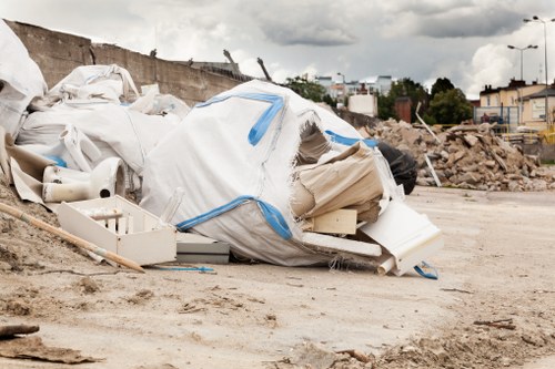 Photo of commercial waste collection vehicle at a business site