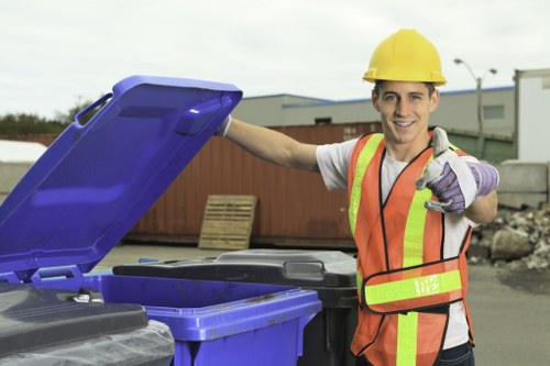 Waste removal truck leaving a commercial site with trained crew
